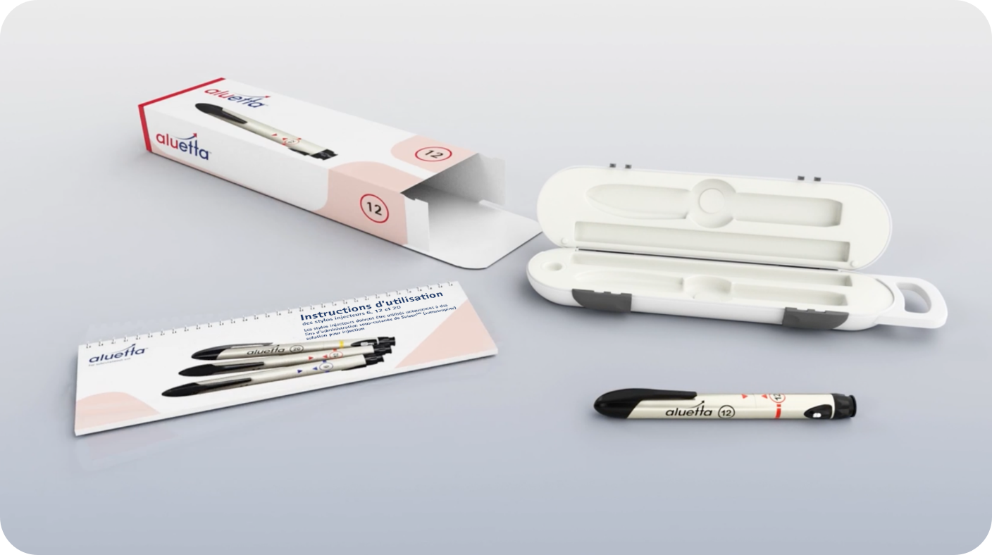 image de la boîte en carton d’aluetta avec la boîte de rangement d’aluetta, le livret d’instructions d’utilisation et le stylo injecteur aluetta