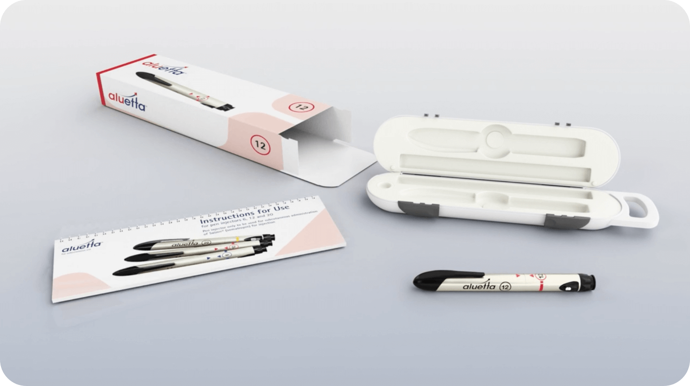 picture of aluetta cardboard box with aluetta storage box, instructions for use booklet, and the aluetta pen injector