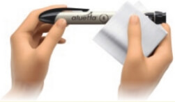 Image of hands wiping the outside of the aluetta pen with a clean damp cloth whenever needed