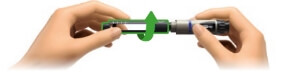 Image of hands twisting to remove the cartridge holder from aluetta pen injector