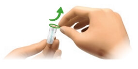 Image of hand peeling off paper from a new needle