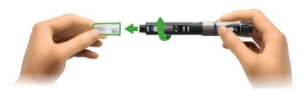 Image of left hand inserting and twisting the needle onto the cartridge holder that is held in the right hand