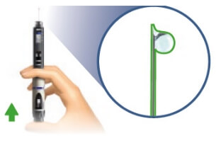 Image of injector pen with needle pointing upward and hand pushing the dose injection button until it stops with tiny drop or drops of liquid appearing at the tip of the needle